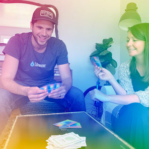 A man and woman sitting around a table playing the Enneagame
